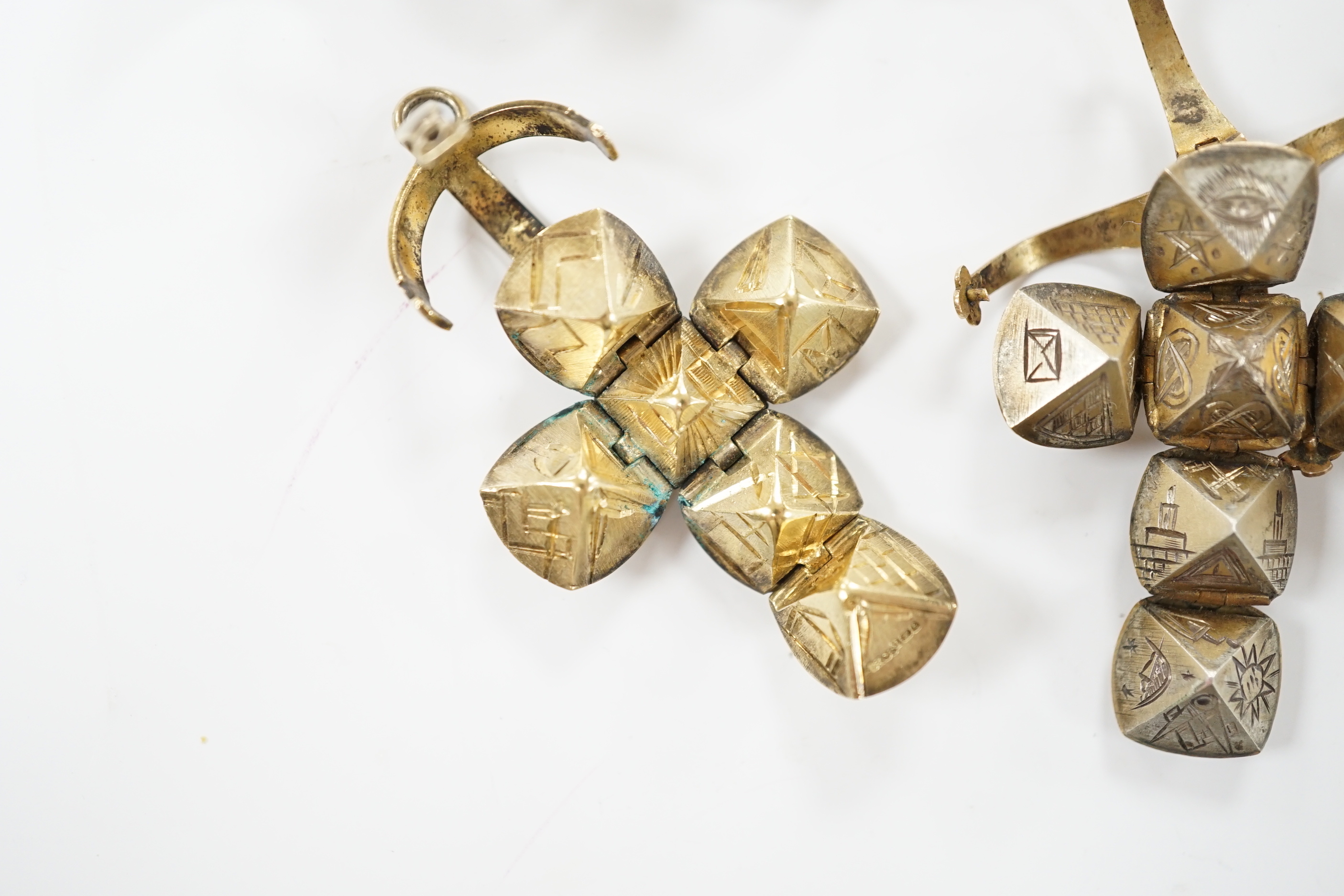 Three assorted masonic ball charms, one stamped 9ct and one other folding ball charm, largest 25mm.